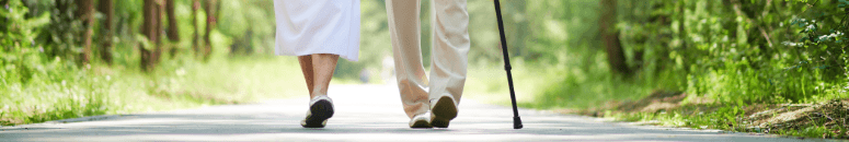 elderly couple walking close up of feet