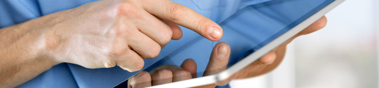 Close up of nurse working on a tablet