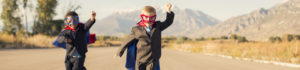Young Boys in Superhero Costumes and Business Suits are Running