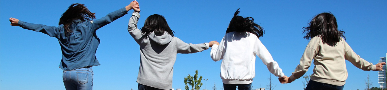 Teenagers walking hand in hand