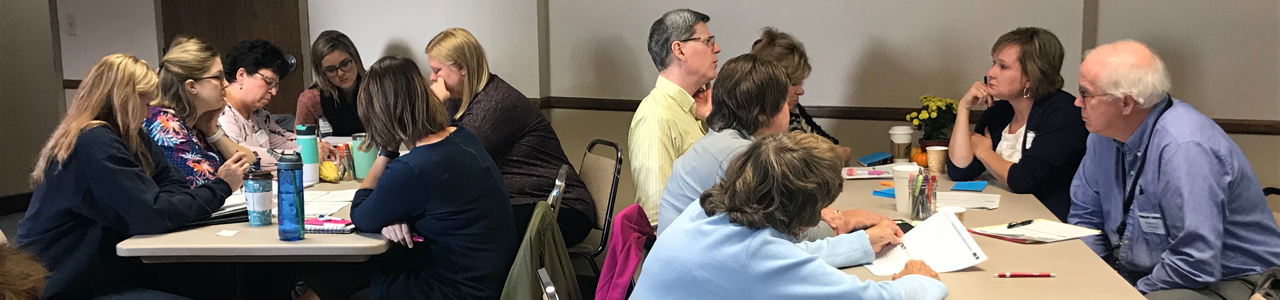 Healthcare professional engaged in discussion during the Sioux Falls readmission round table event.